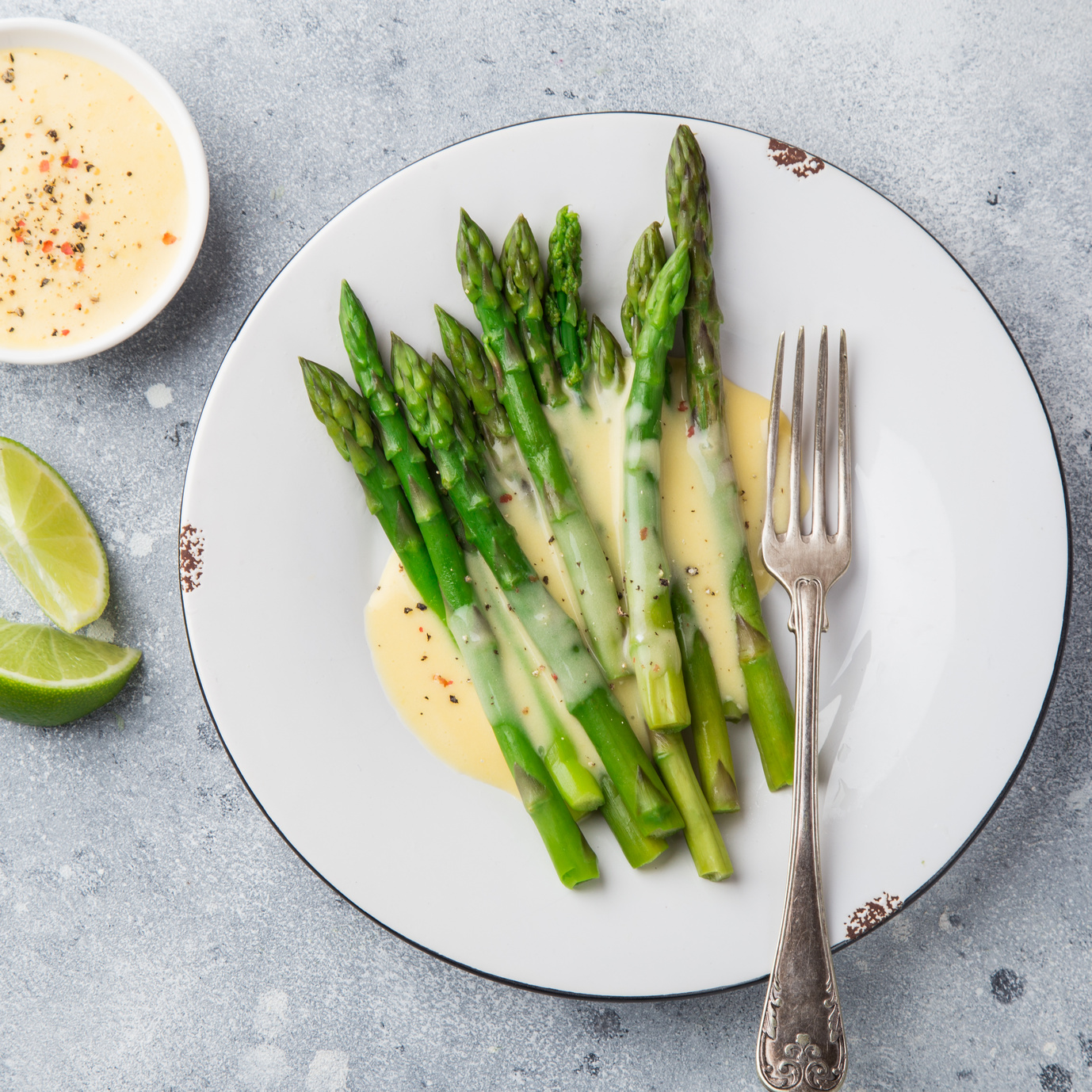 asparagus in hollandaise sause, top view, square image